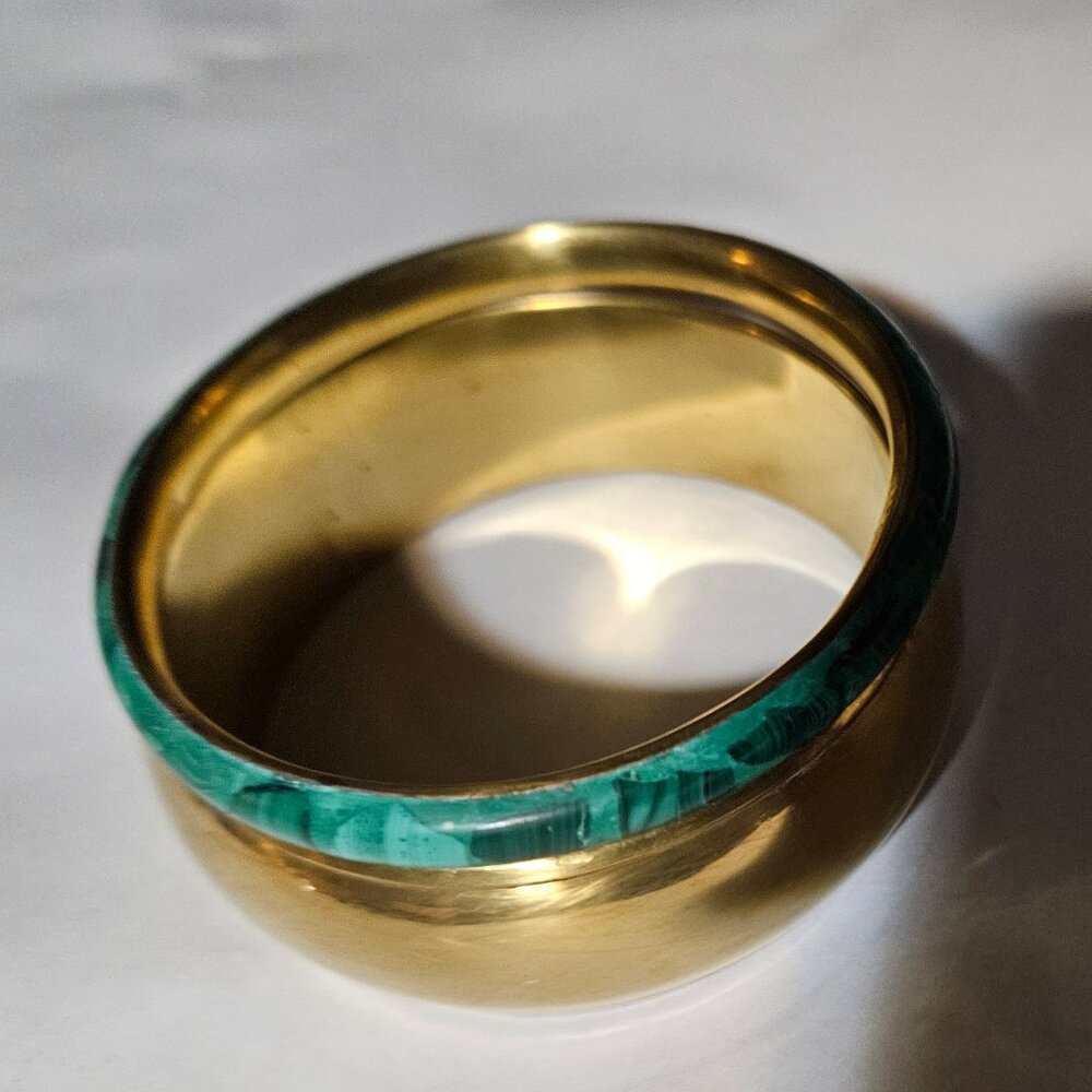 Beautiful, natural malachite pieces inlaid on a solid brass, bangle bracelet